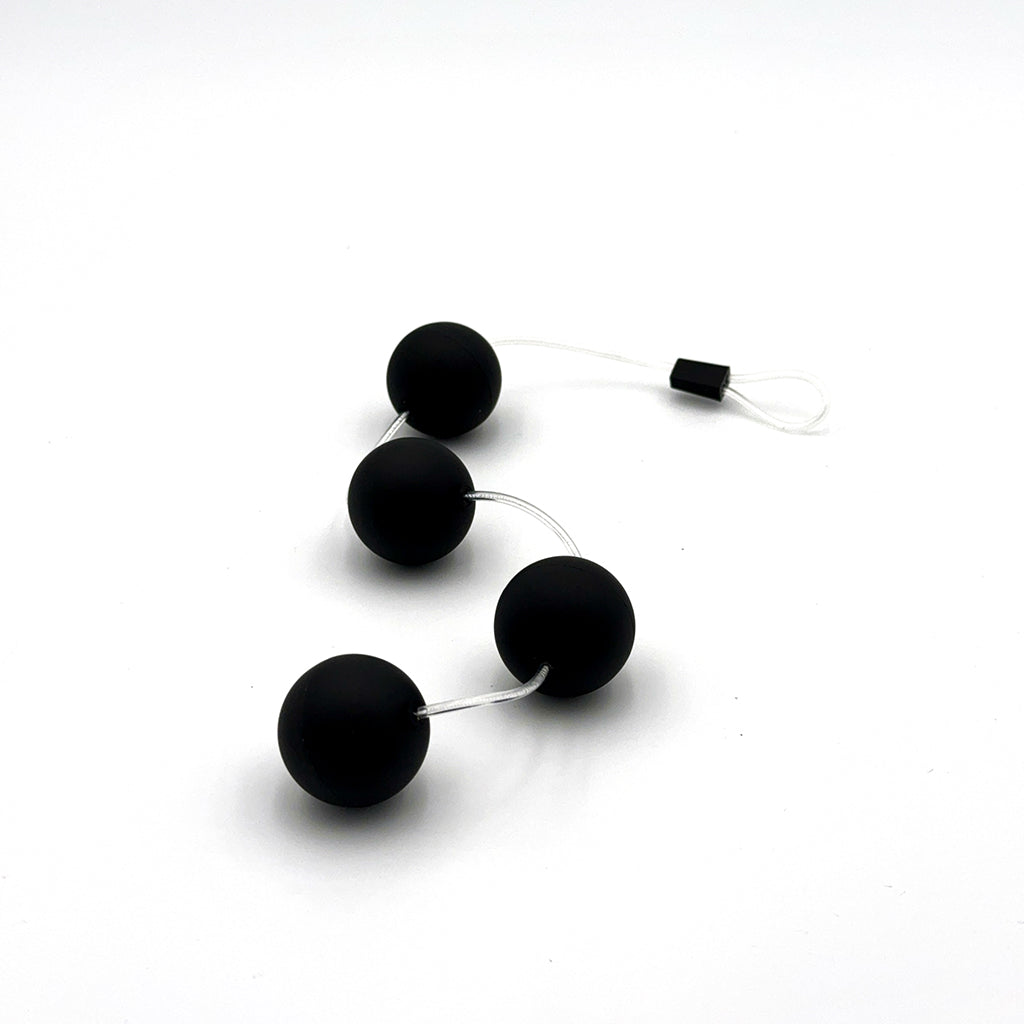 Black anal beads with smooth texture and graduated size.