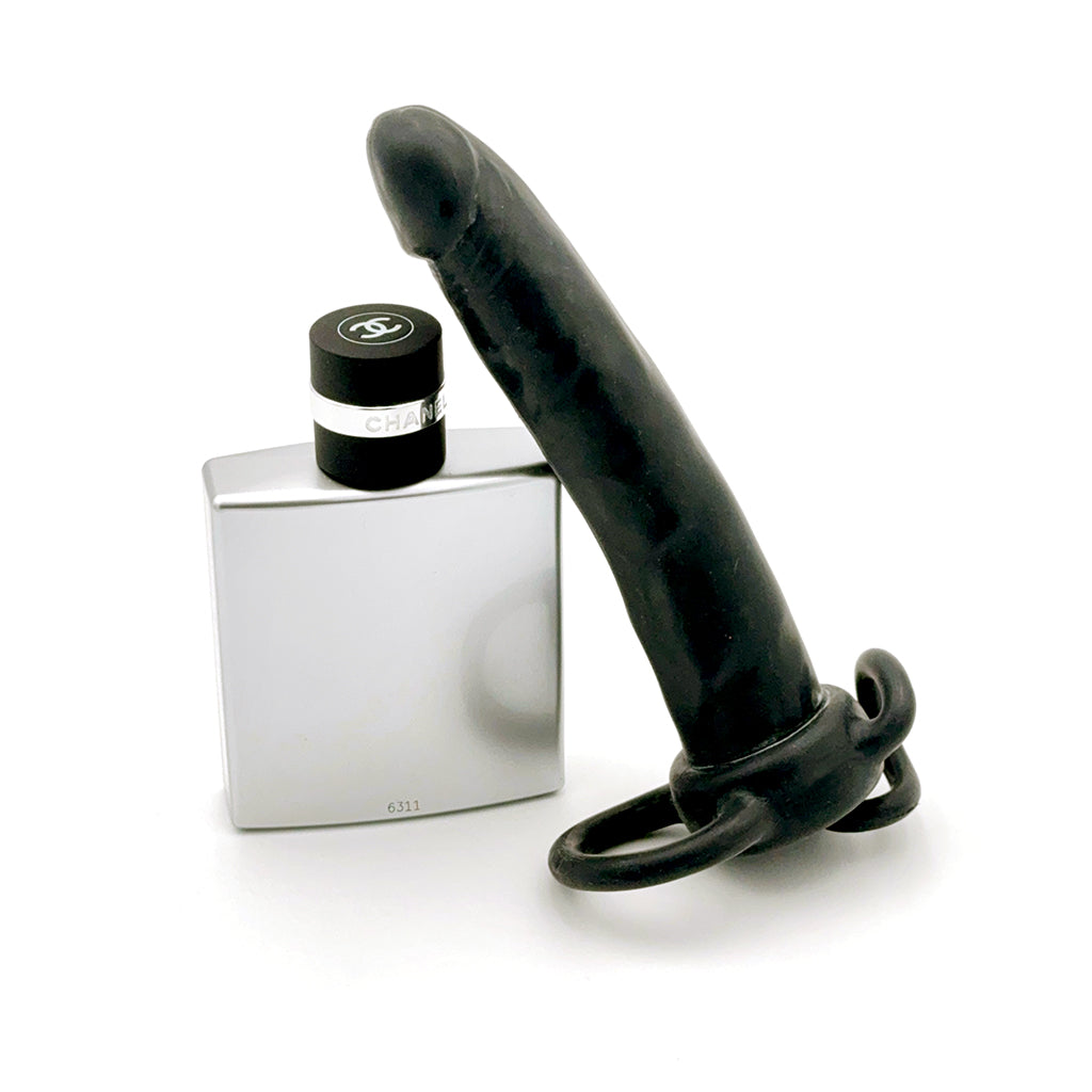 Double Trouble Anal Dong & Cock Ring Black compared to other object for size reference.