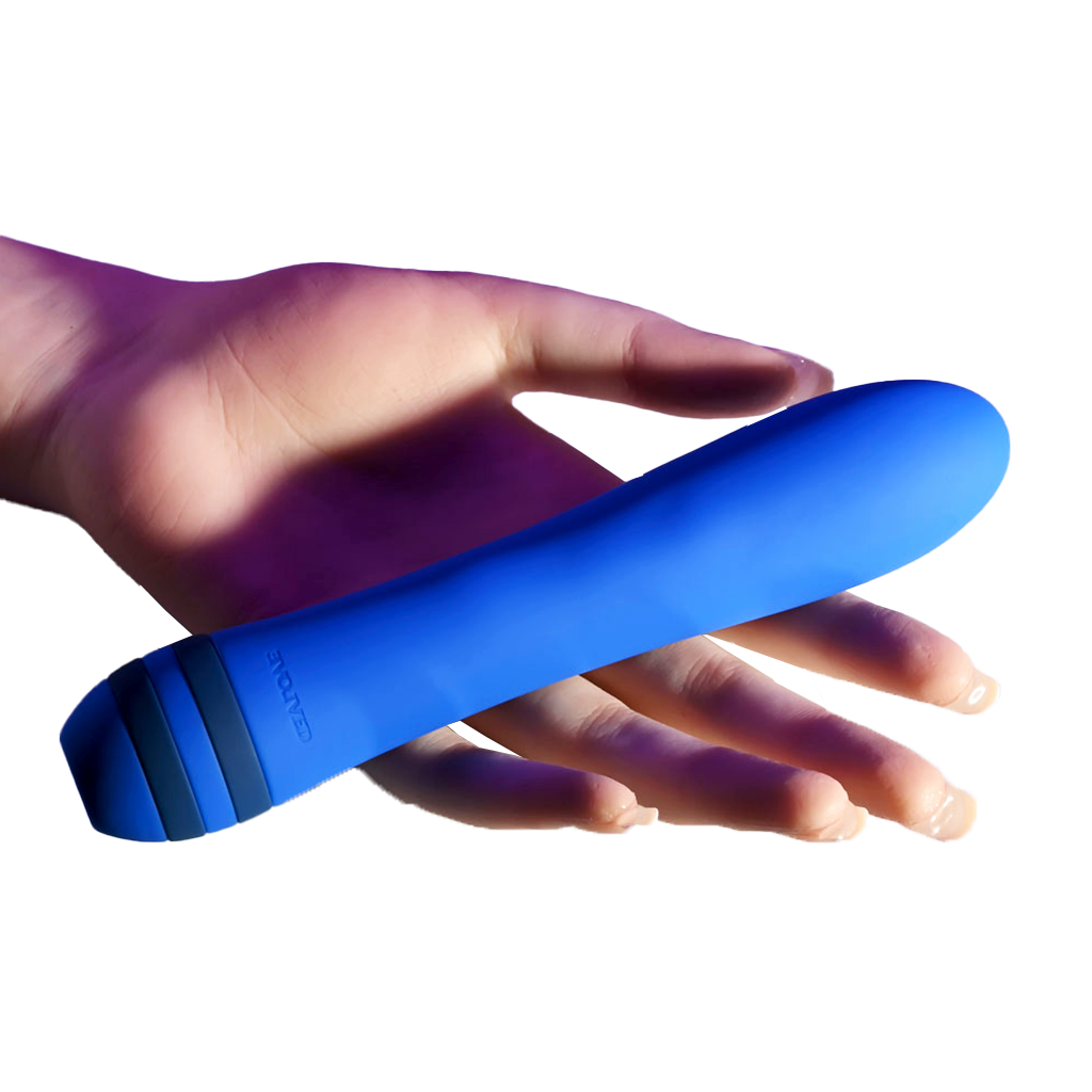 Lady's hand holding The Pleaser Vibrator, showcasing its compact size and ergonomic design for easy handling.