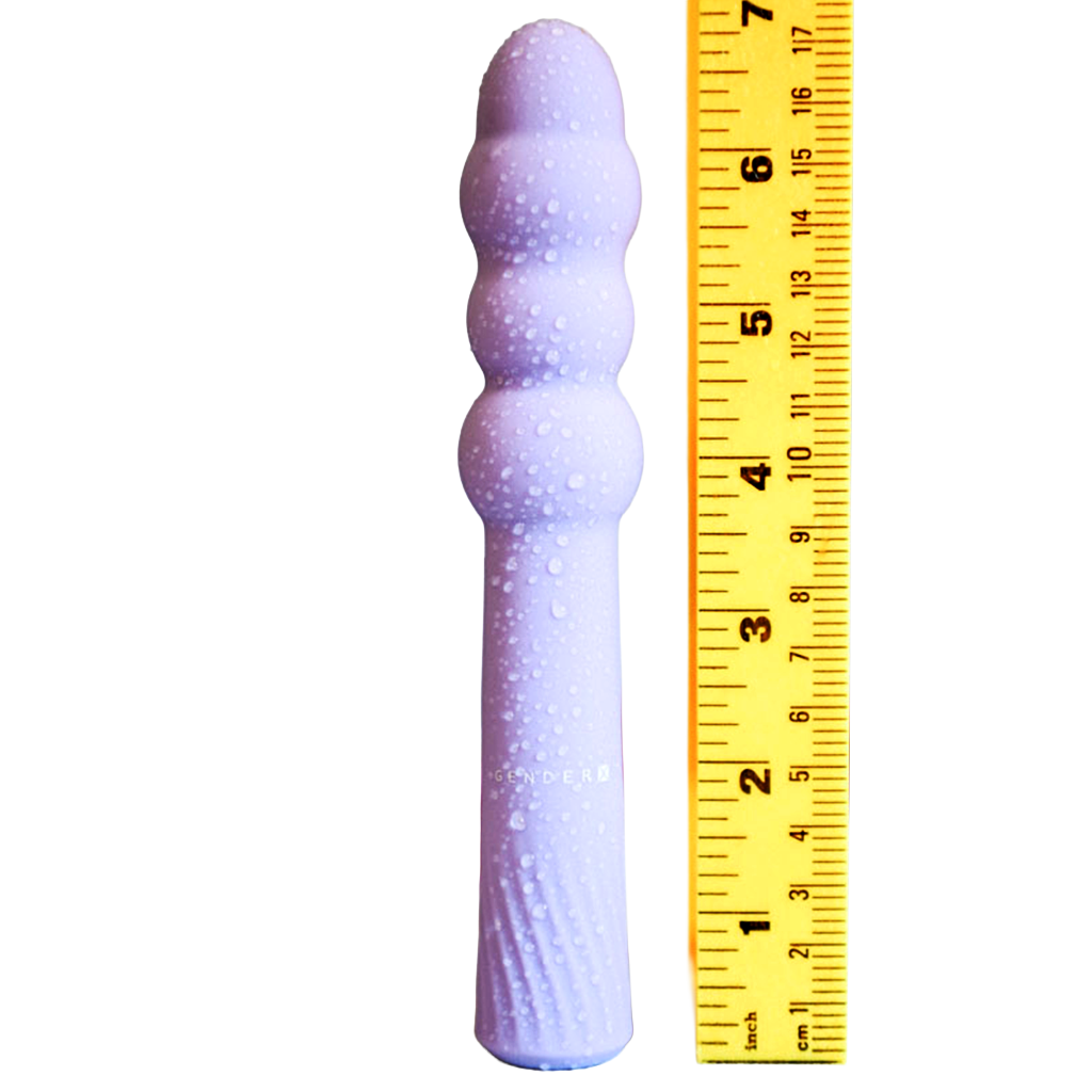 Gender X Bumpy Ride vibrator beside ruler displaying product length and girth for size comparison.