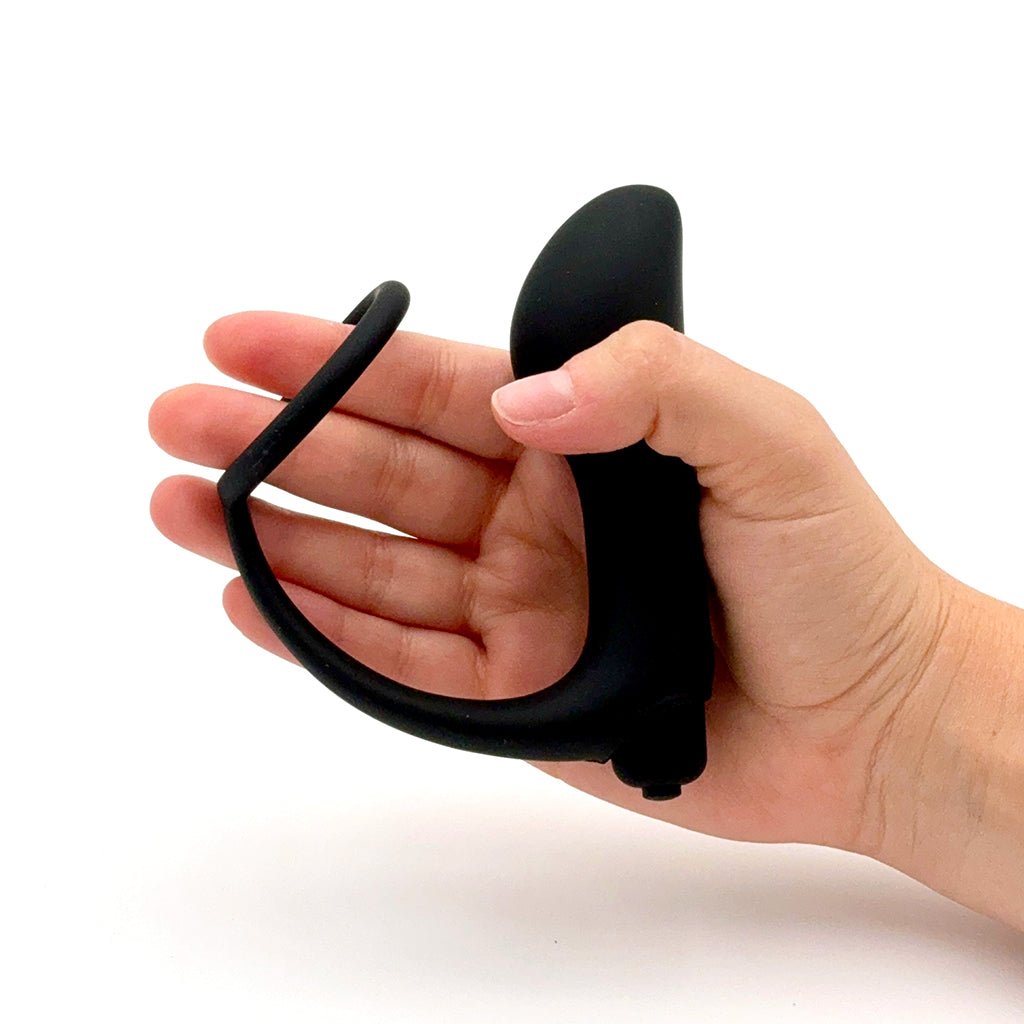 Photo of Prostate Massager with Cock Ring and Vibration in hand showing its size